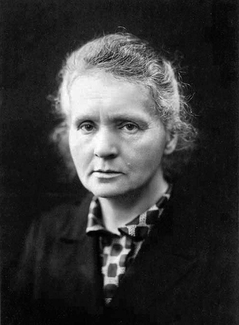 Photo of Marie Curie.

Monochrome image of a woman in a checkered shirt.