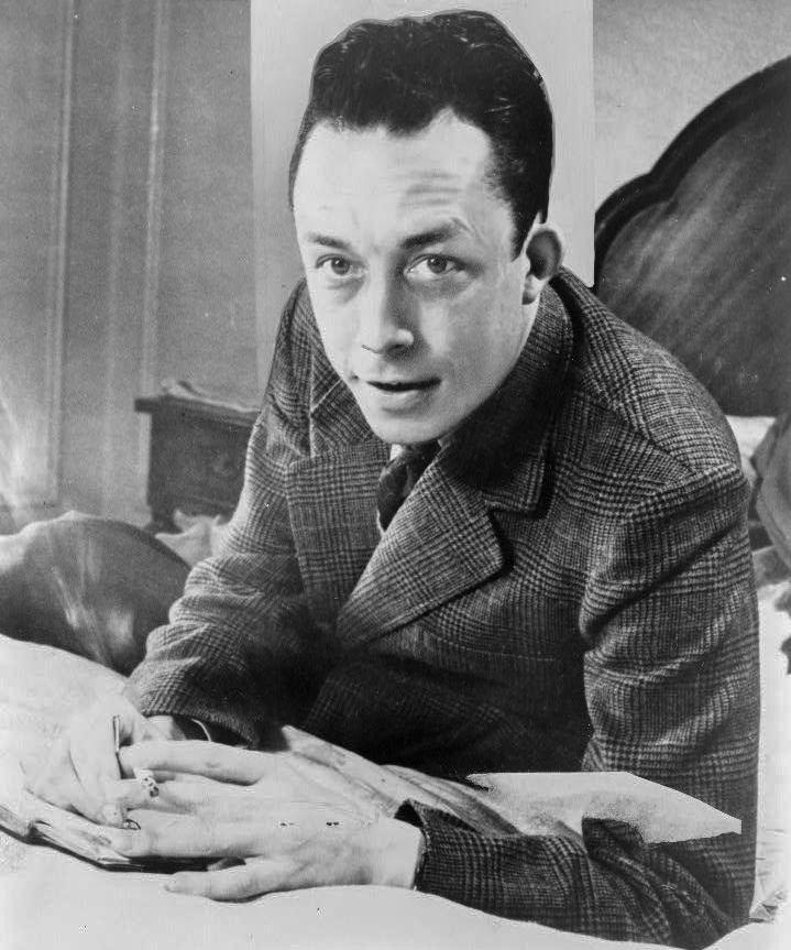 Albert Camus, Nobel prize winner, half-length portrait, seated at desk, facing left, smoking cigarette

Photograph by United Press International - This image is available from the United States Library of Congress's Prints and Photographs division under the digital ID cph.3c08028. 