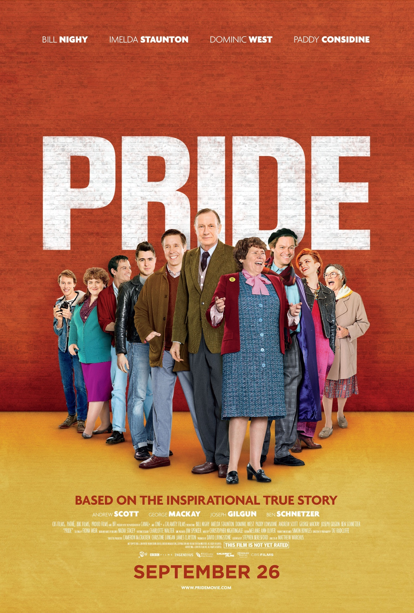 Promotional Movie Poster for the 2014 Movie Pride - Shows many of the characters from the film standing against a red background with the word PRIDE behind them.