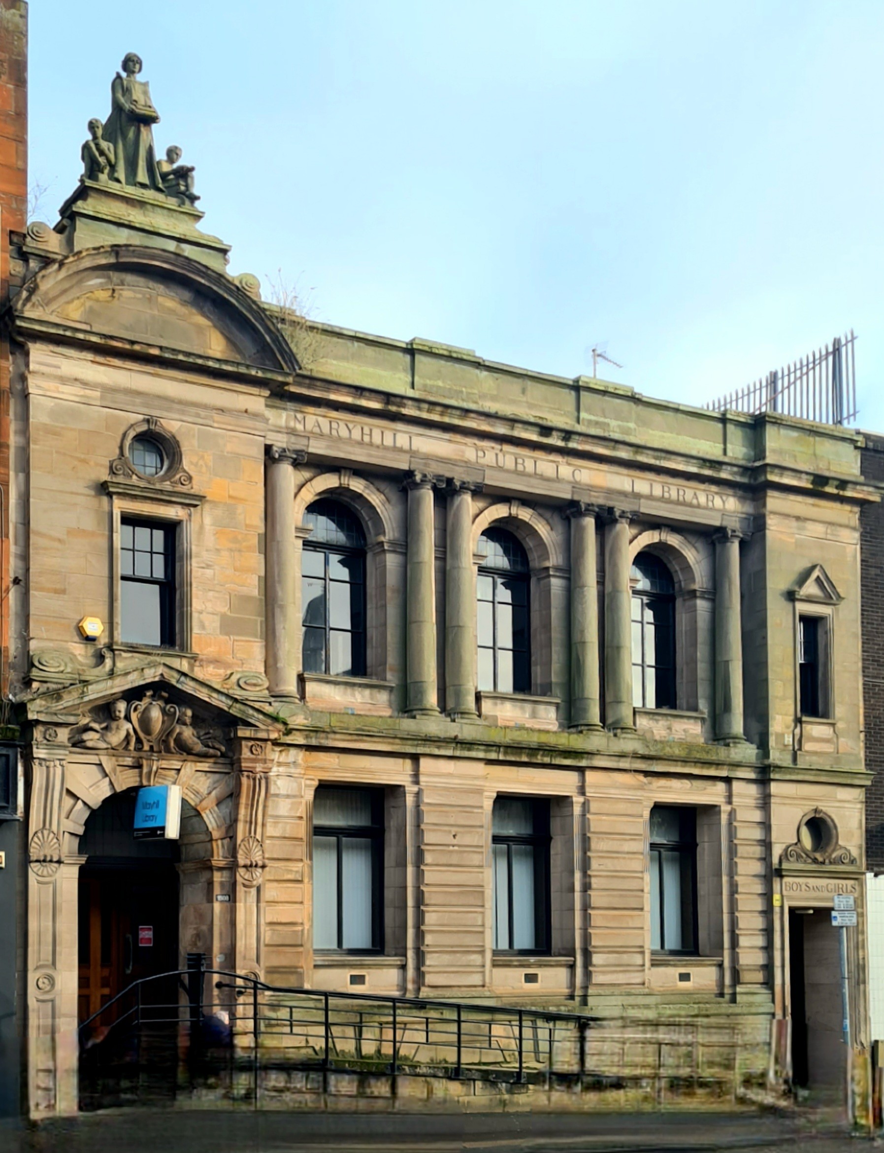 A stone-built Edwardian library with Classical features.