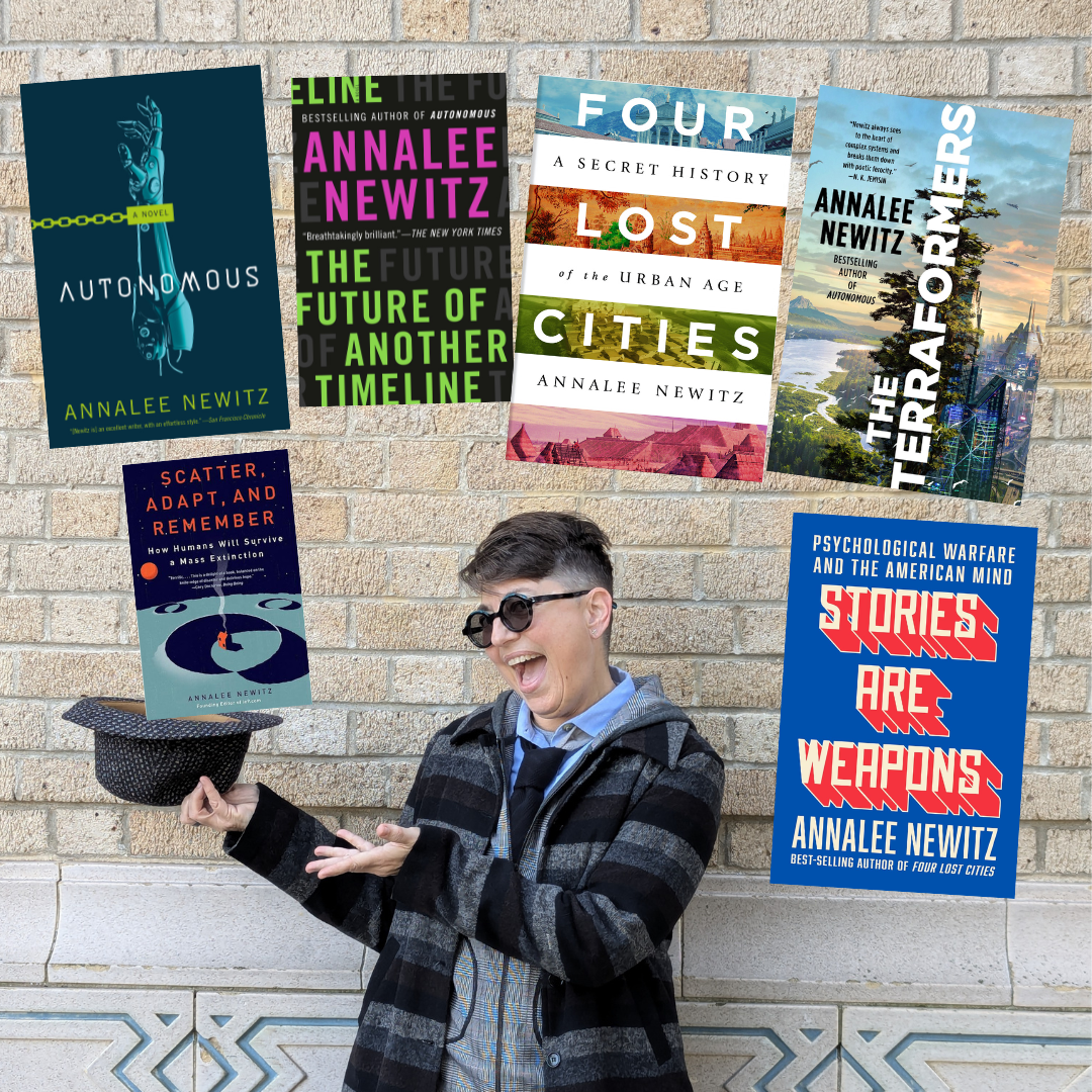 Now I'm magically standing in front of a different wall, more of a cream color (it's actually my local public library). I'm holding out my hat, gesturing at it, and smiling. The covers of my books appear to be flying out of the hat. 