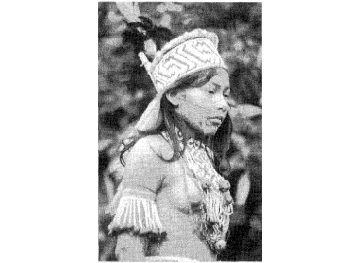 A Piro girl emerges from her Kigimawlo seclusion, body painted and wearing beautifully crafted organic decorations on her head, breast and arms