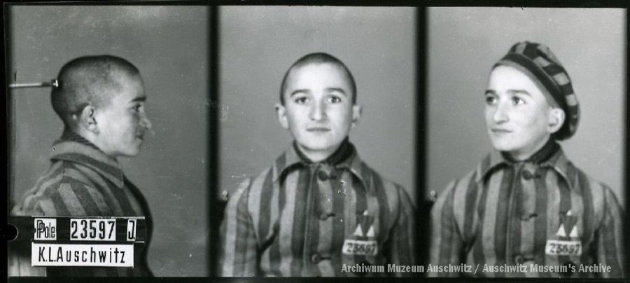 A mugshot registration photograph from Auschwitz. A man with a shaved head wearing a striped uniform photographed in three positions (profile and front with bare head and a photo with a slightly turned head with a hat on). The prisoner number is visible on a marking board on the left.