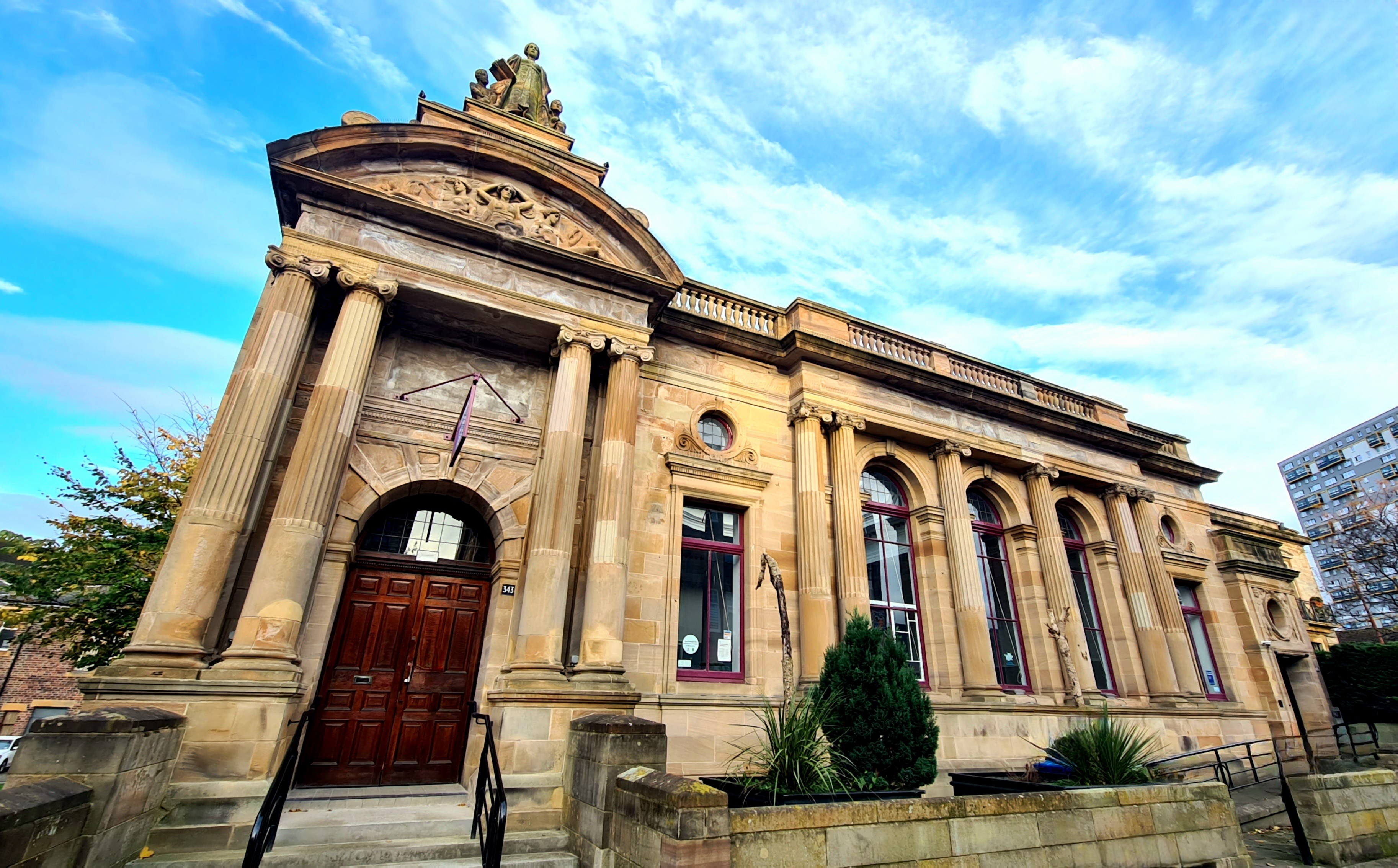 A Classical style blonde sandstone early Edwardian public library.