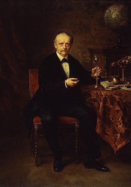 Helmholtz in 1881, portrait by Ludwig Knaus.

In this portrait, Helmholtz is portrayed as a man in his early sixties, with a strong, thoughtful expression. His face is characterized by sharp, defined features, including a high forehead, prominent nose, and a well-groomed mustache and beard that were typical of his era. His hair is gray, thinning slightly, but still full, adding to his distinguished appearance.

Helmholtz is dressed in formal attire, wearing a dark suit with a white shirt and a bow tie, which reflects his professional standing and the seriousness with which he approached his scientific work. The clothing is meticulously detailed, with the texture of the fabric and the folds of the suit rendered with precision, showcasing Knaus's skill as a portraitist.