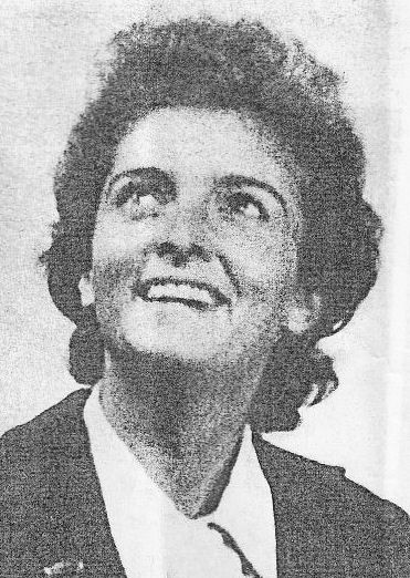 A newspaper photo of Ginette Jullian later in life. She is a white woman with wavy dark hair.