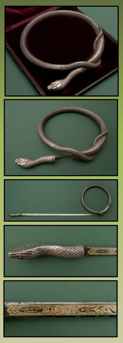 A torque (torc, a type of solid necklace) in the design of a snake. The snake's head protrudes from the entwined circle of the body, and a sharp tug will release the long blade bent around the body of the torque.