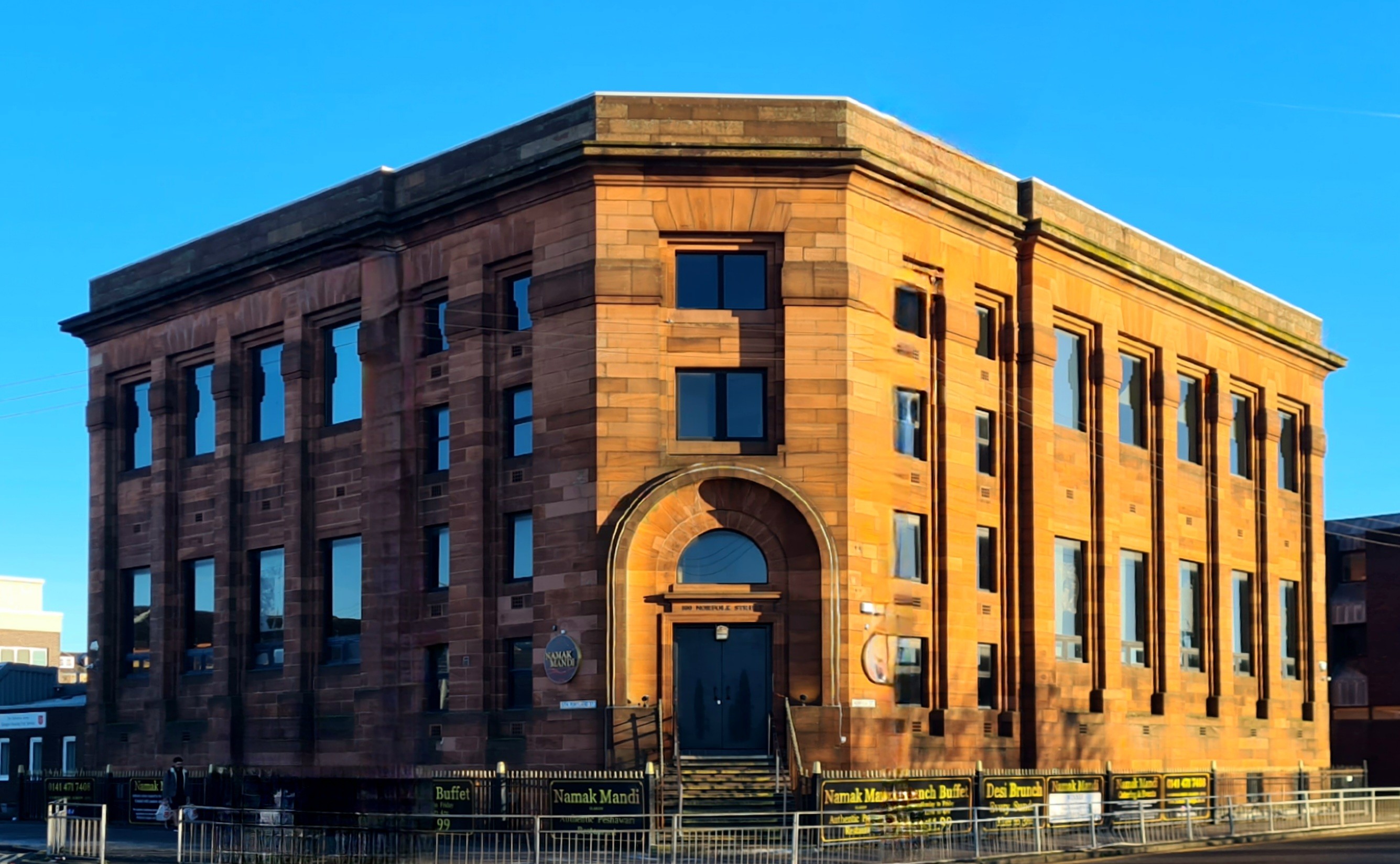 A 1930s red sandstone Glasgow library building.