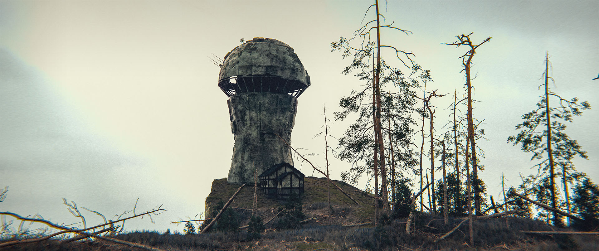 Wide shot, exterior, day -
A tower sitting on the edge of a cliff overlooking a lake.