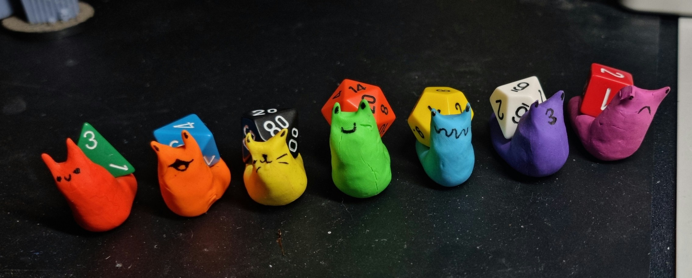 7 multi coloured snails but the shells on their backs are different sided roleplay dice