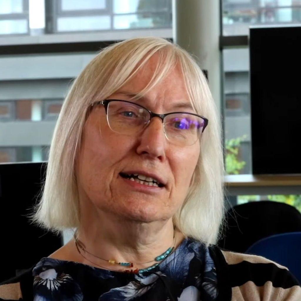  photo of Dr Sophie Wilson, a white woman with mid length grey hair and glasses