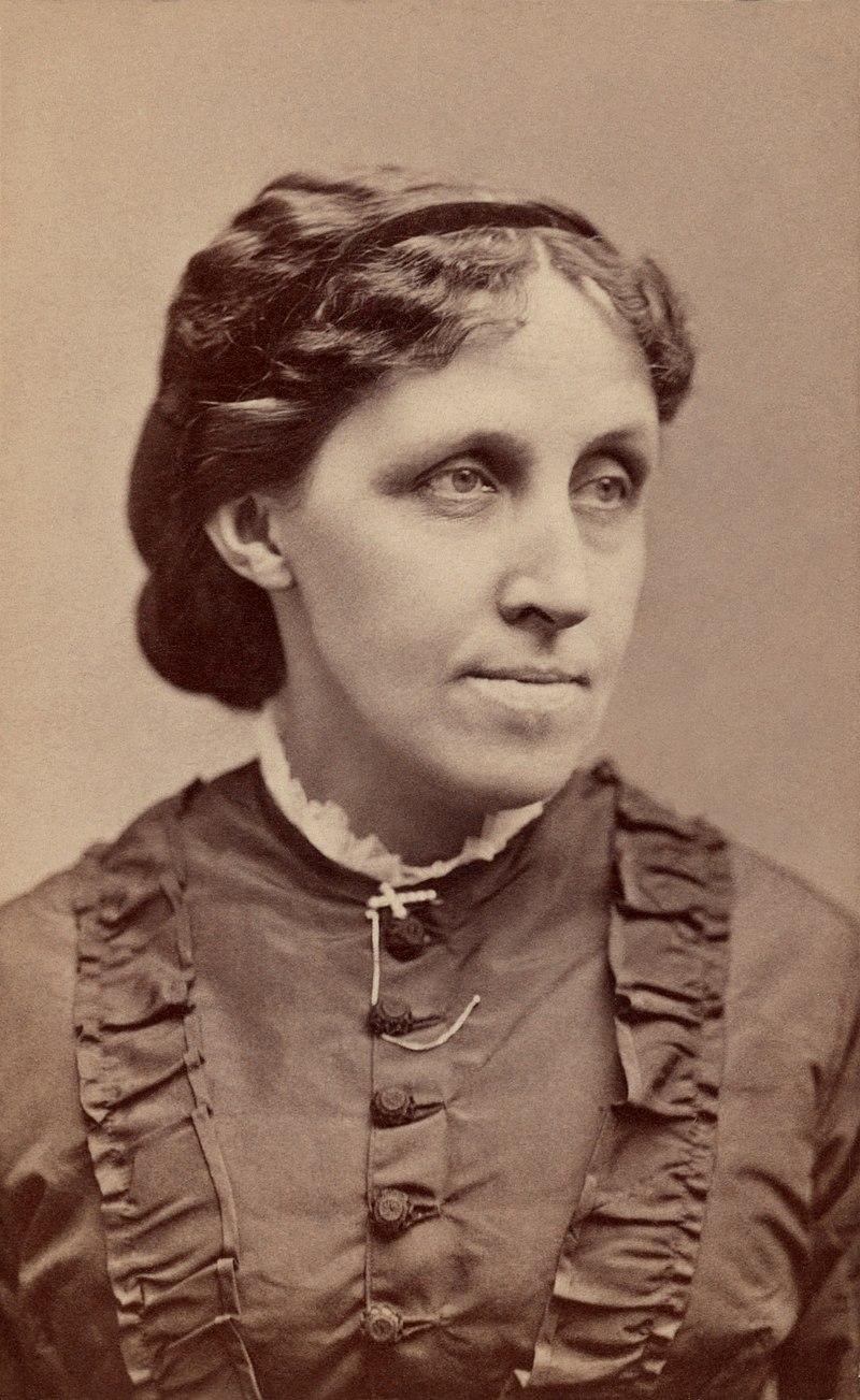 Louisa May Alcott c. 1870, writer, abolitionist, and Civil War nurse. Warren's Portraits, 465 Washington St., Boston.

Alcott’s face is captured in a three-quarter profile, looking slightly to her right, with a contemplative and composed expression.

She is dressed in a formal Victorian-era dress, characterized by its high neckline adorned with a small, lace-trimmed collar.

The bodice is decorated with ruching (gathered fabric) and a row of cloth-covered buttons, typical of 19th-century women’s fashion.

Her hair is neatly styled, parted down the center and pulled back, revealing soft waves around the forehead, which was a practical and modest hairstyle of the time.

Her face is serious and refined, with strong features, including high cheekbones and a straight nose, reflecting both her intellectual nature and determination.