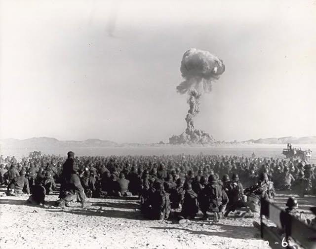 A black and white photograph showing a bunch of people staring at a mushroom cloud from a nuclear bomb going off in the distance. Back when people did that kind of thing. 

The US conducted underground tests for their A-bombs including one where they placed a half-ton manhole cover over the top of a 500ft shaft to "contain" the explosion.

August 27th, 1957, they detonated the bomb and highspeed cameras caught a couple of frames of the manhole cover popping off at over 125,000 mph.

That makes it the fastest manmade object in history, travelling at five times the necessary velocity to escape Earth's gravity. 

Physicists recently calculated that the cover would not have burned up before escaping the atmosphere, and passed the orbit of Pluto sometime in 1961.

Use your imaginations.