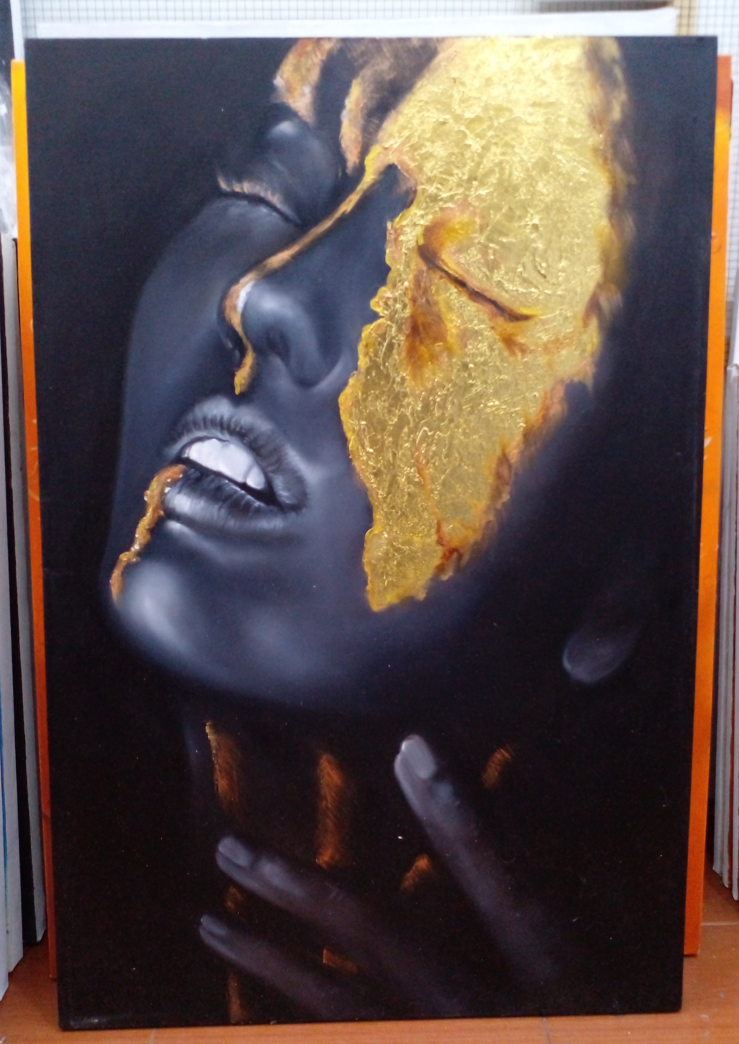 a painting of a head of a person, angled upwards, gold leaf covering the cheek and eye  and a line of gold coming down the nose to the throat, their fingertips touching their throat, eyes closed, a black background 