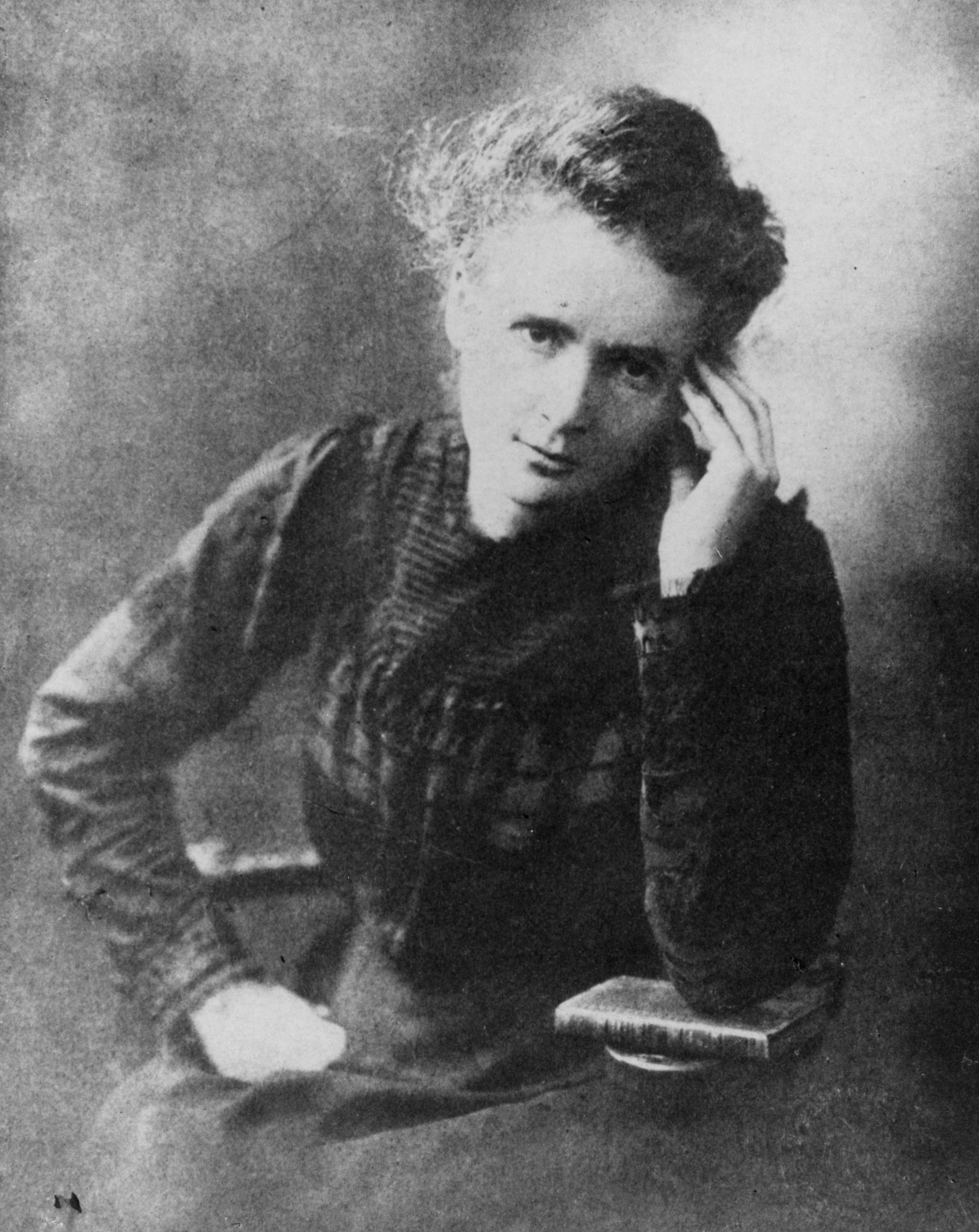 Marie Curie. Credit: AIP Emilio Segrè Visual Archives, W. F. Meggers Gallery of Nobel Laureates Collection.

She is shown wearing formal, dark clothing, reflective of her era and status as a pioneering scientist. Her face carries a serious and contemplative expression, highlighting her intense dedication to her work. The background is usually plain, ensuring the focus remains on her as a central figure