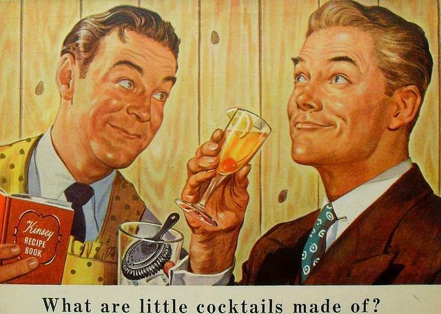 Detail from a vintage ad for Kinsey whiskey. An illustration of two men shown from the chest up. One is wearing an apron and holding a book titled Kinsey Recipe Book. He looks expectantly at the other man, who is sipping of a fruity cocktail with a contemplative air. Text reads: "What are little cocktails made of?"