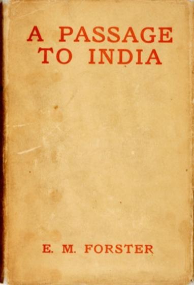 First edition cover of A Passage To India, 1924.

The cover has a simple and minimalistic design, featuring a beige or light brown background with red lettering. 

The title, A Passage to India, is prominently displayed at the top in bold, capital letters, while the author's name, E. M. Forster, appears at the bottom in a smaller but similarly styled red font. 