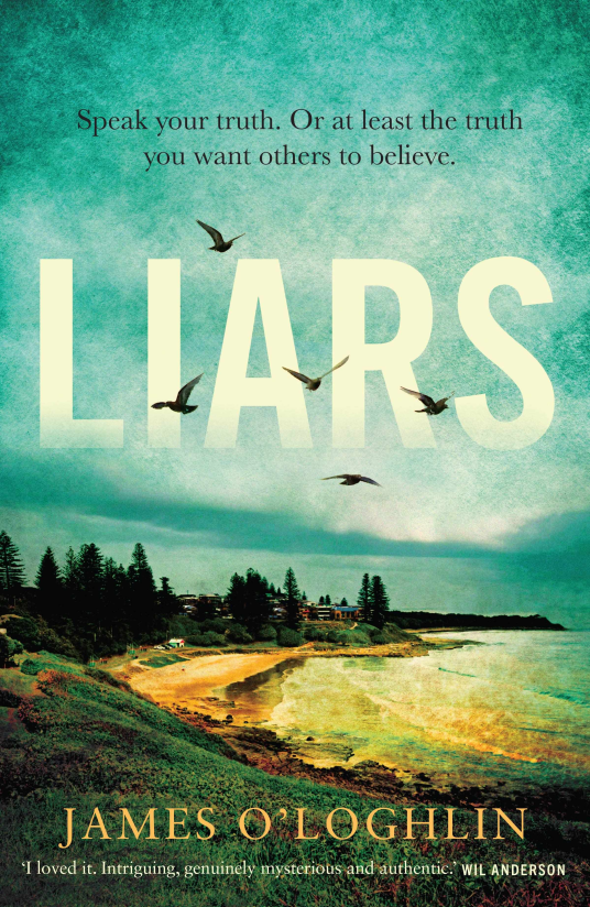 The book cover for Liars by James O'Loghlin includes the tagline 'Speak your truth. Or at least the truth you want others to believe.'. The image is looking out across a small beach to a small cluster of buildings. There are green trees amongst the buildings and grass rolling down a small hill to the sand. The sea is yellow green in colour with small waves. The sky above is blue green, cloudy with a shelf of cloud above the buildings. The title of the book is in large white lettering in the middle of the sky and there are seagulls flying around.