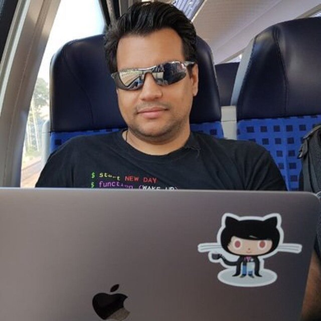 Photo of myself, wearing mirrored sunglasses in front of a laptop while in a train; describes me pretty accurate: I love good weather, traveling and as a computer nerd I feel most comfortable with my hands on a keyboard