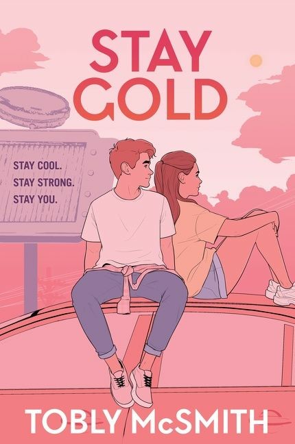 Cover art for Stay Gold. Two teens - a boy and a girl - sit on the roof of a car, watching the sunset.