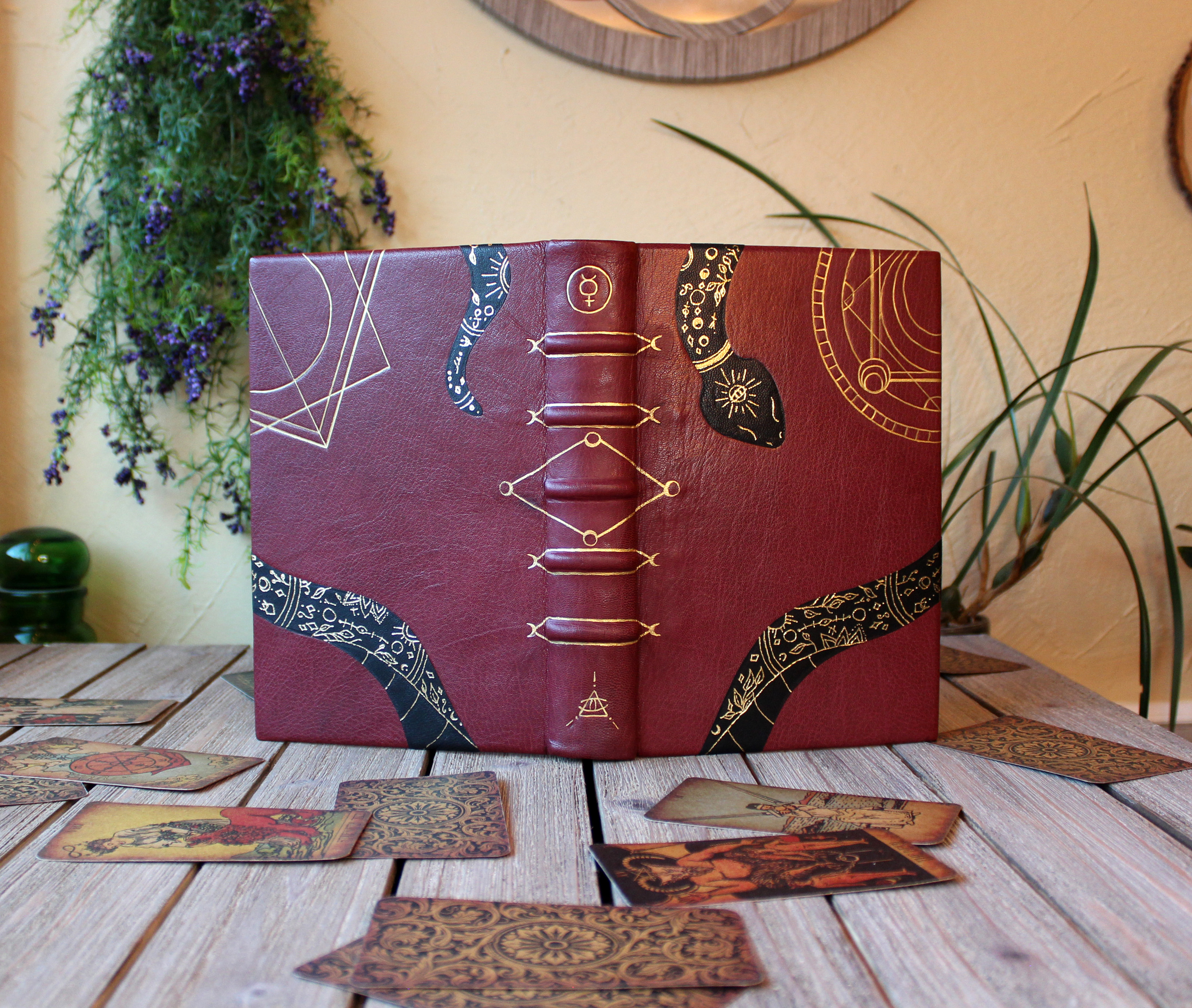 A red leather book open to show both covers. 